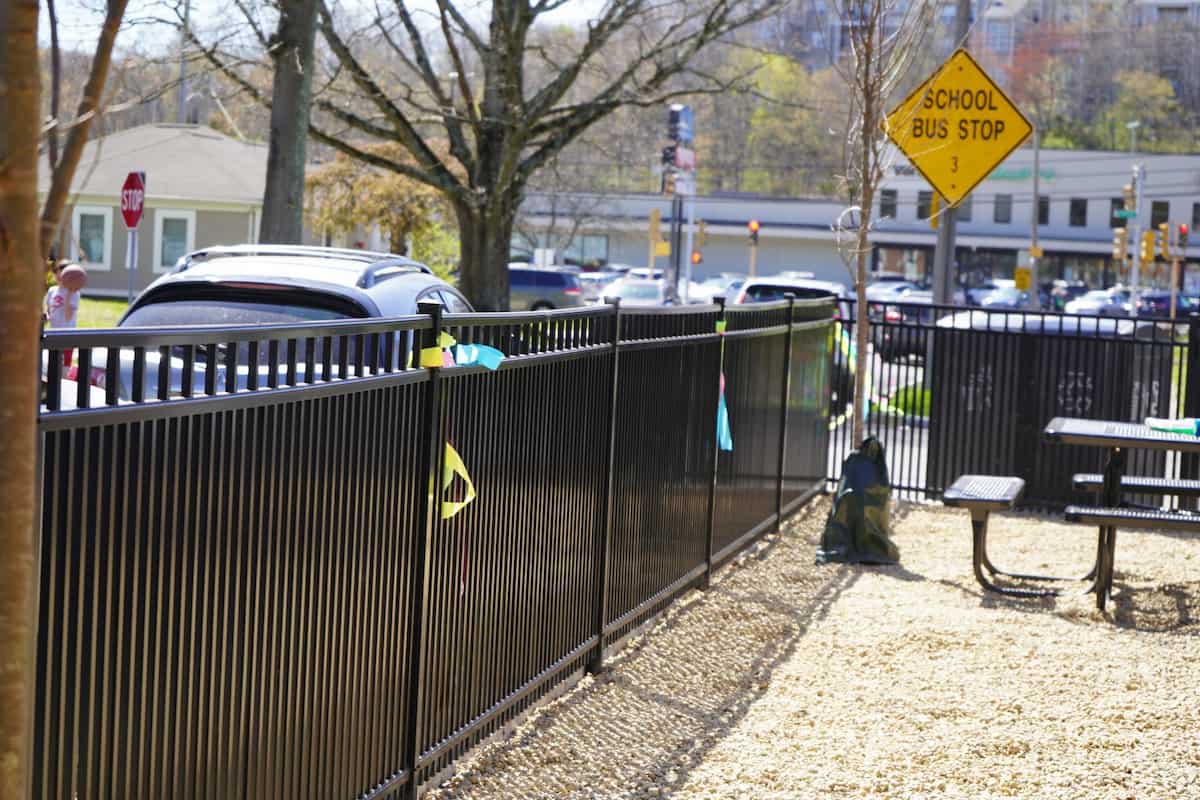 Professional black metal fence installation in Auburndale, MA by experienced fencing contractors