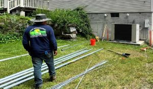 How to Fix a Leaning Fence Post Without Digging: Easy DIY and Professional Repair Guide leaning fence post repair preparation materials installation Fence repair preparation showing materials and metal supports used to fix leaning fence
